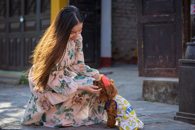 a dog and her owner in matching styles and clothes