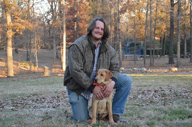 man and man's best friend being happy together